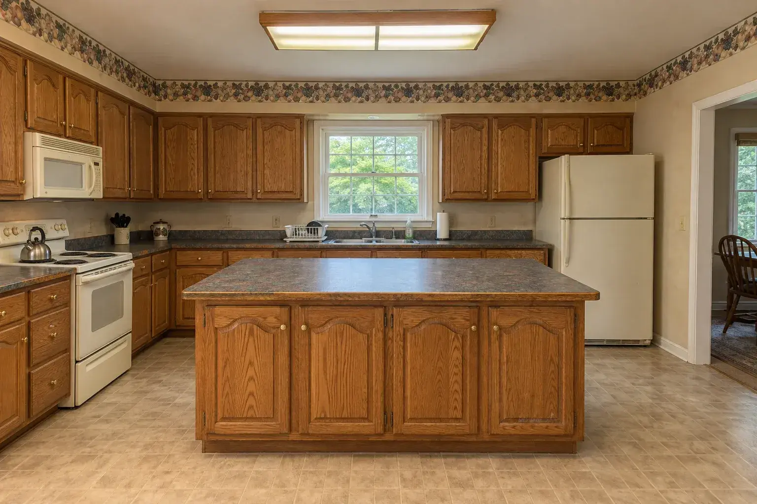 Dated oak cabinetry before the renovation